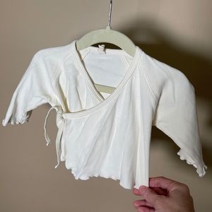 Quincy Mae cream colored wrap top. 6-12 month.